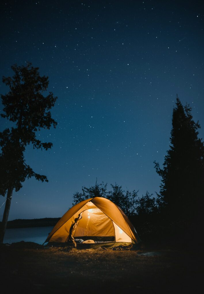 Canvas tents pitched in an open meadow