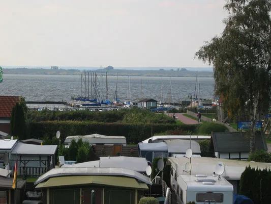Campsite pitches with view toward the harbor and lake