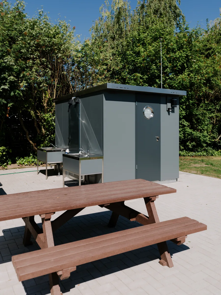 Outdoor wash station and guest facility area