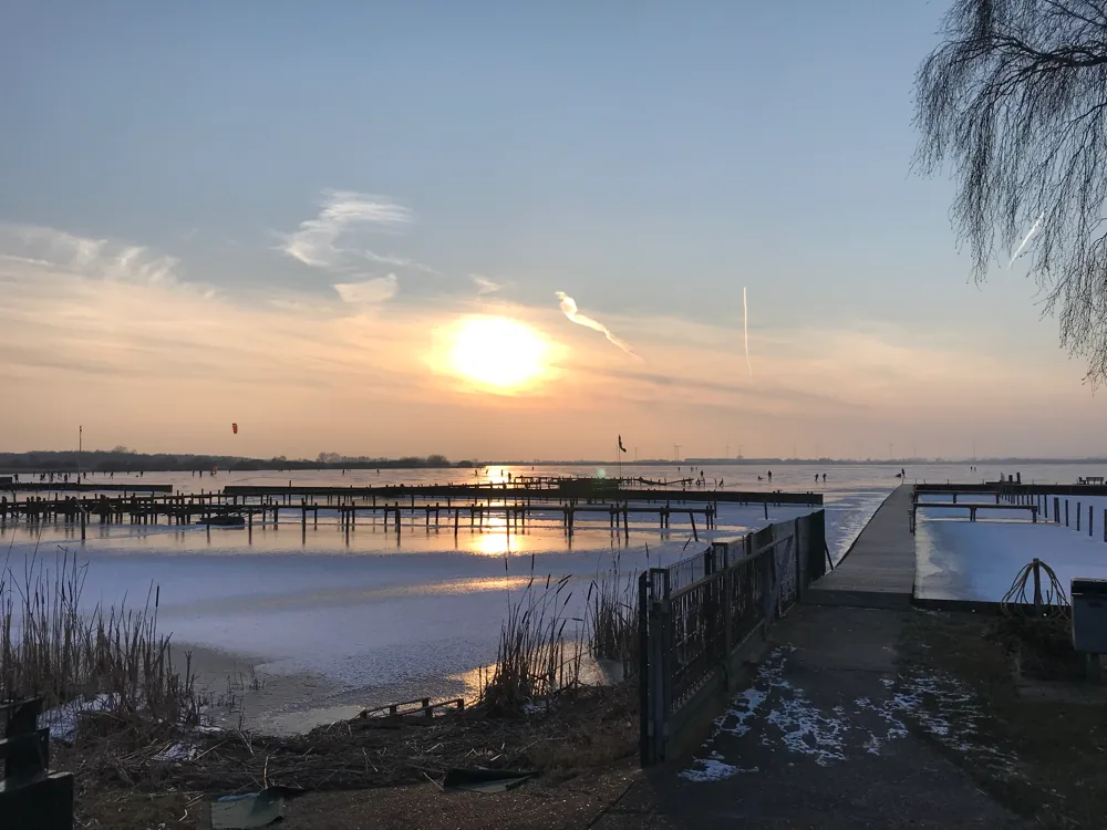 Sunset over Dummer See near the harbor path