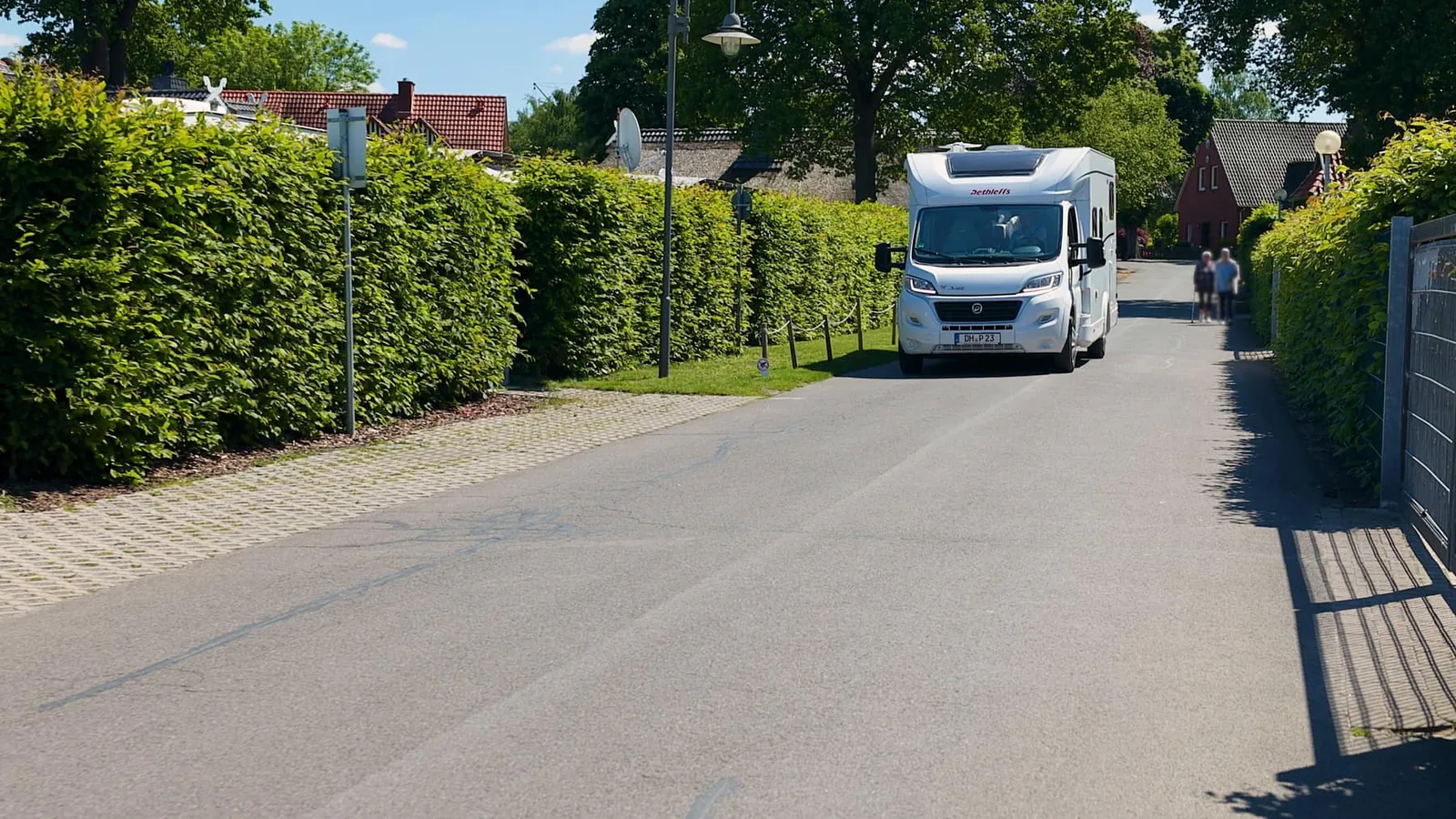 Quiet C12 campsite road with motorhome arrival